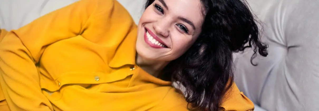 woman-smiling-yellow